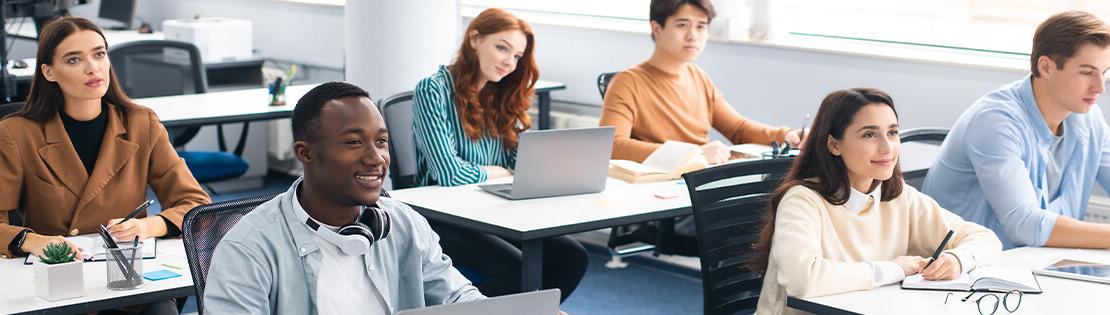 Student sit in a classroom in excitement listening to a lecture